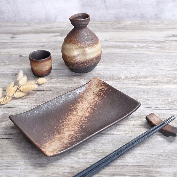 

rustic japanese style ceramic sake bottle carafe cup gold sand on borwn glaze pattern restaurant wine drinkware