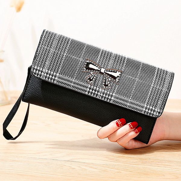 

new style children's bag casual wild embossed bow clutch handbag fashion ladies coin purse mobile phone bag