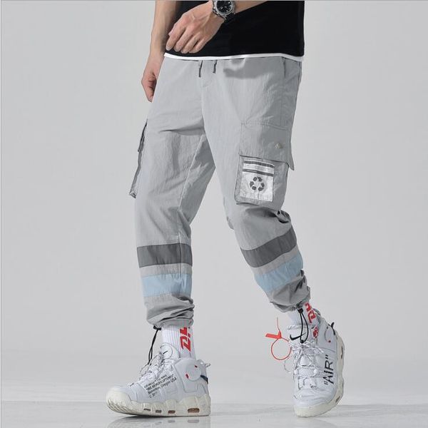 

Хип-хоп мужчины Streetwaer брюки лоскутное светоотражающая полоса спортивный комбине