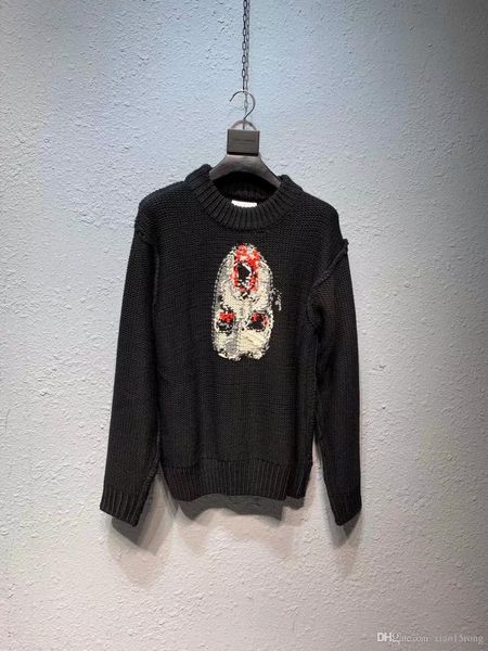 

doublet style high street clown vampire wears a hand-knitted wool sweater with a loose turtleneck, White;black