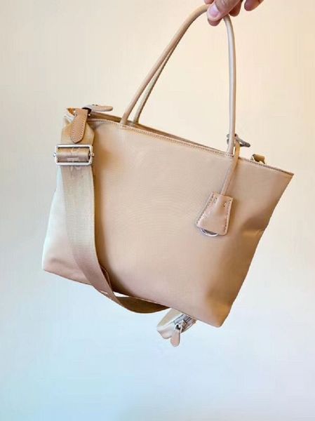 

designer luxury shopping bag sportstyle bag is made of imported parachute material and fabric size: 32 * 32 * 12.5cm