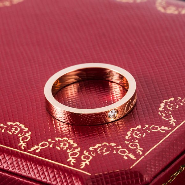 

Дизайнерский бренд ювелирные изделия кольца Мужчины / женщины Полный CZ Алмазный Любовь Кольцо Золото 3 Цвет Пара кольцо титана стали отполированный Lover кольца с коробкой