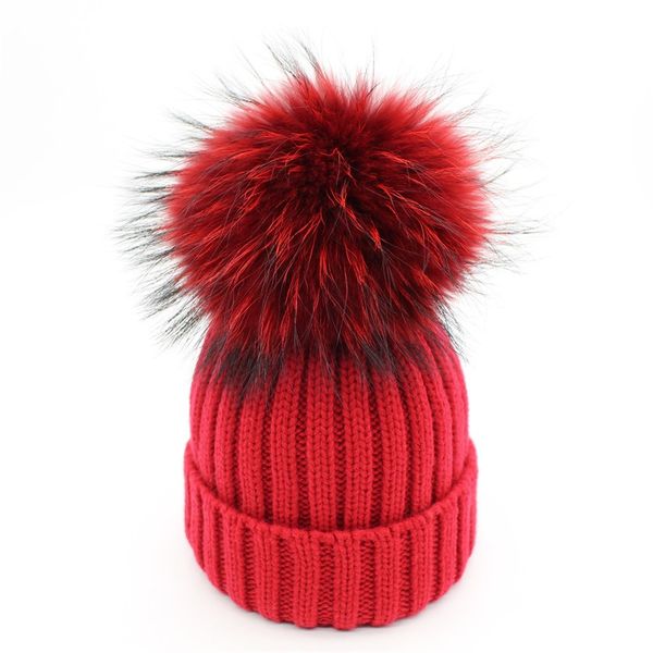 red winter hat with pom pom