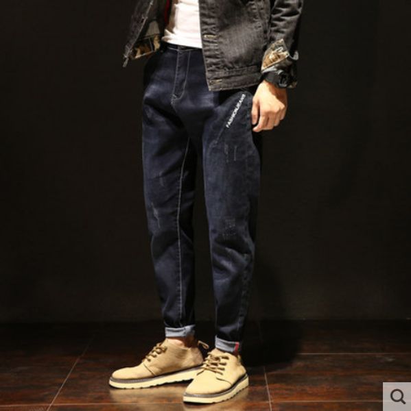 

dark blue jeans are popular logo trend loose big yards fatty