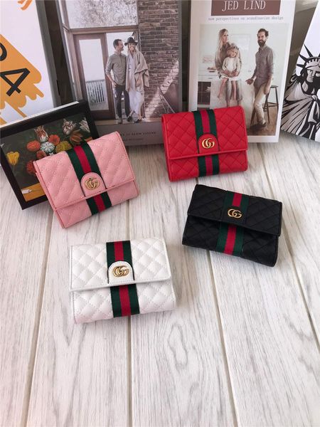 

full leather ribbon trimmed with rhomme stitch short flip purse with signature ribbon and signature hardware lined with rose print rayon in