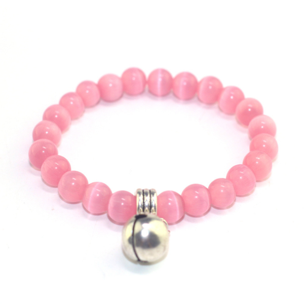 

fyjs unique siver plated small bell with pink cat eye stone stretchy bracelet for women jewelry, Golden;silver