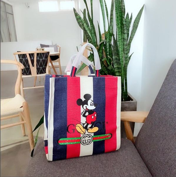 

2020 new ladies large capacity striped cartoon character handbag wild simple shopping bag ladies shoulder bag clutch bag