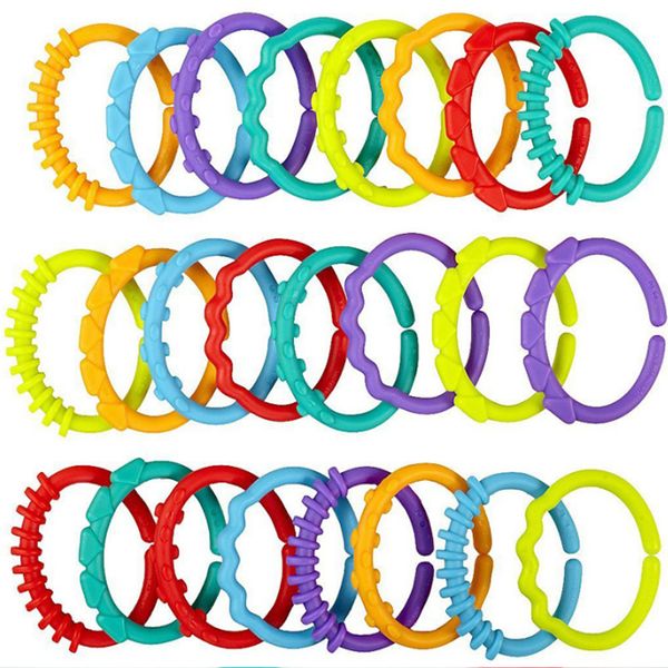 

8pcs/set plastic grip baby teether rattles rubber rainbow ring molars rattle safety toys for children crib bed stroller hanging