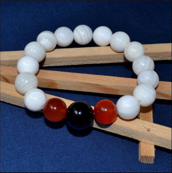 

1023 hainan tanmen natural stone red bracelet in three shells, Black