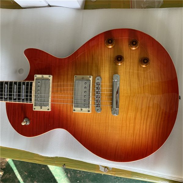 

021 6 string electric guitar, mahogany body with flamed maple orange paint