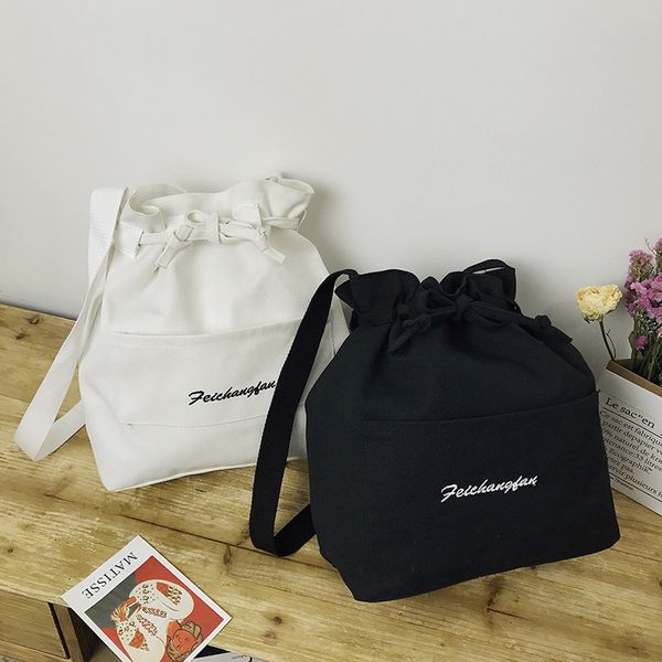 

alphabet embroidery beam mouth diagonal bag shoulder canvas bag solid color small female wild messenger bucket