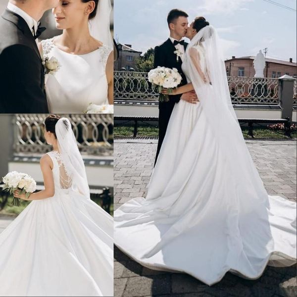 

2020 modest satin wedding dresses jewel sleeveless lace applique beaded vestido de noiva sheer back bridal gowns, White