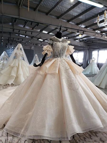 Abiti da sposa con perline scintillanti Abiti da sposa Maniche svasate con volant Abito da sposa principessa di lusso Abito da sposa personalizzato Coda grande Robe De Mariage