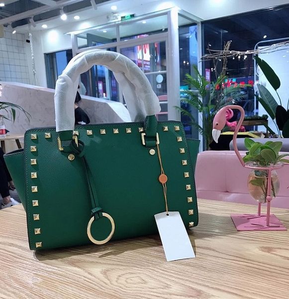 

fashion brand lady handbag european and american designer shoulder bag rivet solid color genuine leather design bag 28*22cm designer handbag