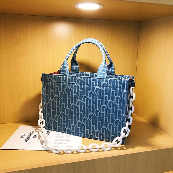 

leatherluggagetag 2020 new pearl short-distance travel handbag large capacity denim bag presbyopia niche tote bag