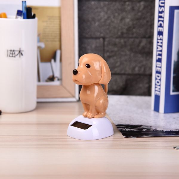 

1pcs cute car ornament abs solar powered shaking swing head dog lovely cartoon dog design automobile decoration dashboard toys