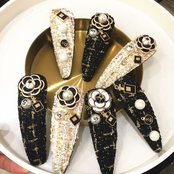 

popular black and white camellia pearl perfume bottle wool hairpin, Golden;white