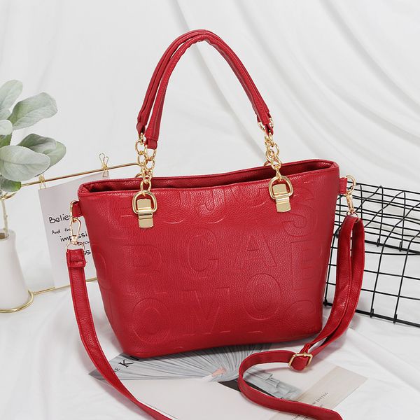 

spring and summer new fashion embossed messenger bag casual middle-aged bag
