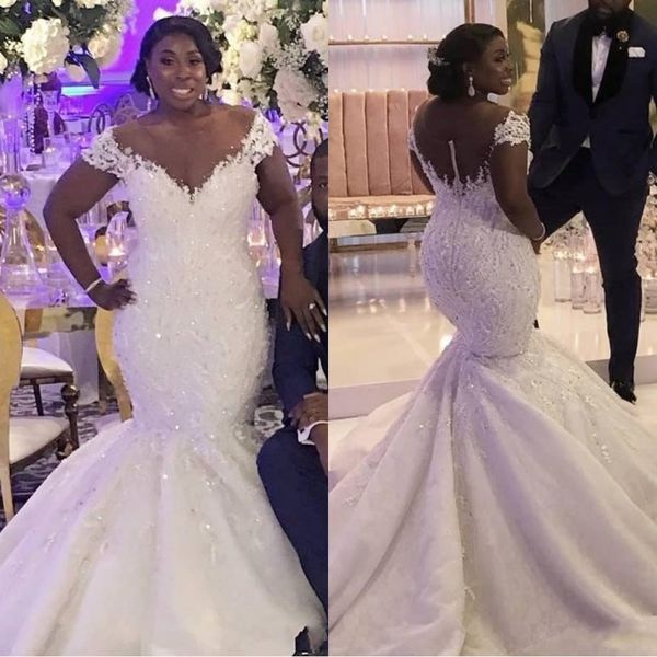

2020 modern african plus size mermaid wedding dresses off shoulder lace appliques beaded sheer button plus size court train bridal gowns