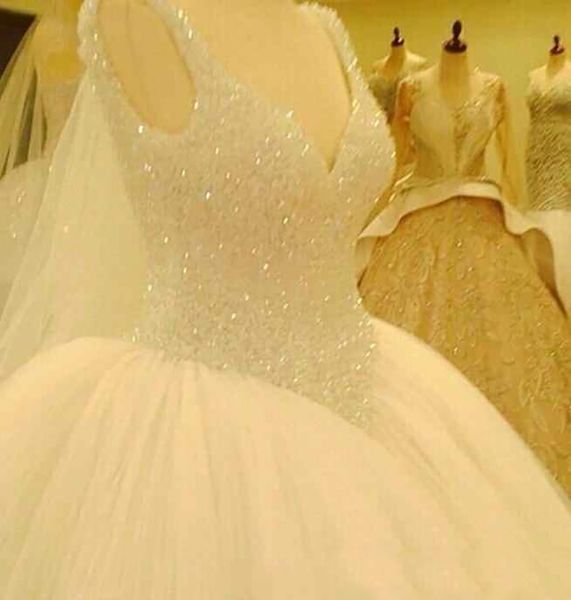 

luxurious crystal beaded wedding dresses v neck ball gown puffy tulle princess bridal gown ing, White