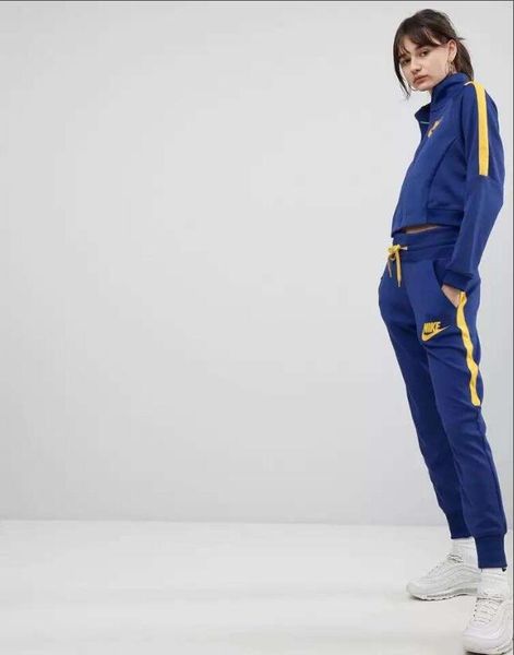 Blue and yellow nike tracksuit womens Clearance