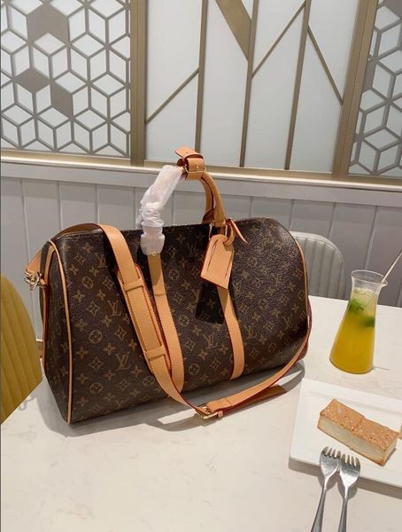 

popular fashion men and women travel bags with a unique large capacity with a wide shoulder cross - body bag