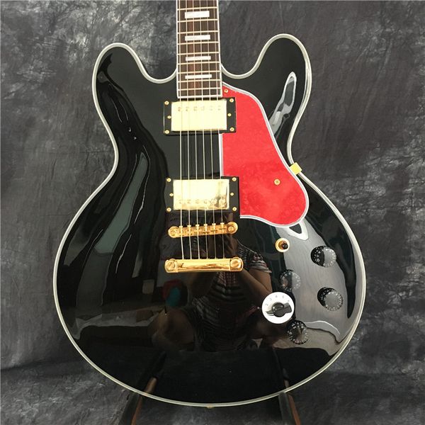 

wholesale black jazz electric guitar, with golden lp pickup, red pearl shield, provide customized services. ing