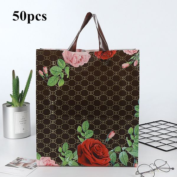 

50pc / lot rose pattern plastic gift bags thick portable storage shopping bags clothing store wedding party supplies