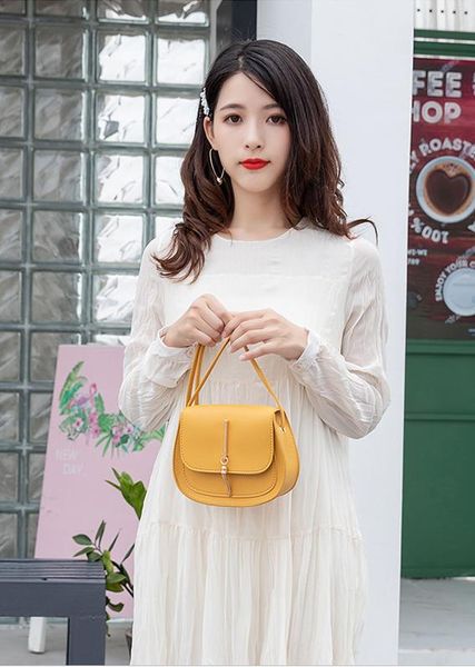 

2020 designer handbags new tassel small round bag ladies crossbody female saddle bag in stock