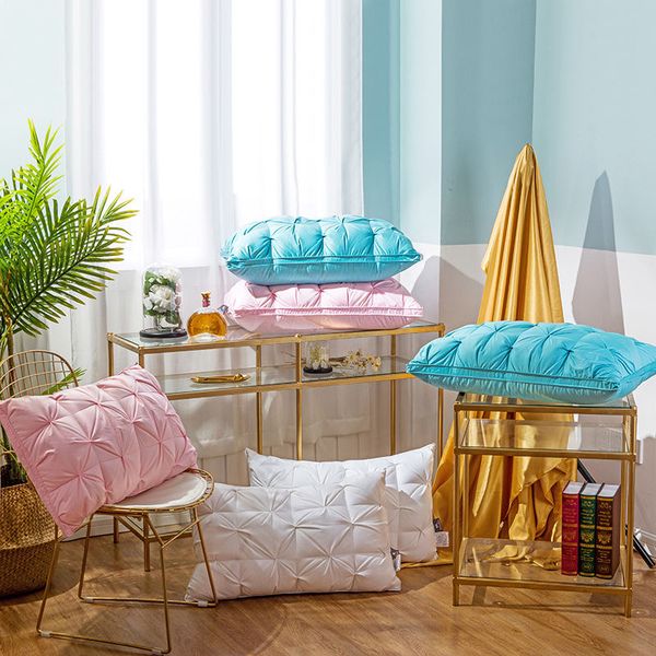 

white velvet pillows effectively secure three height bedding