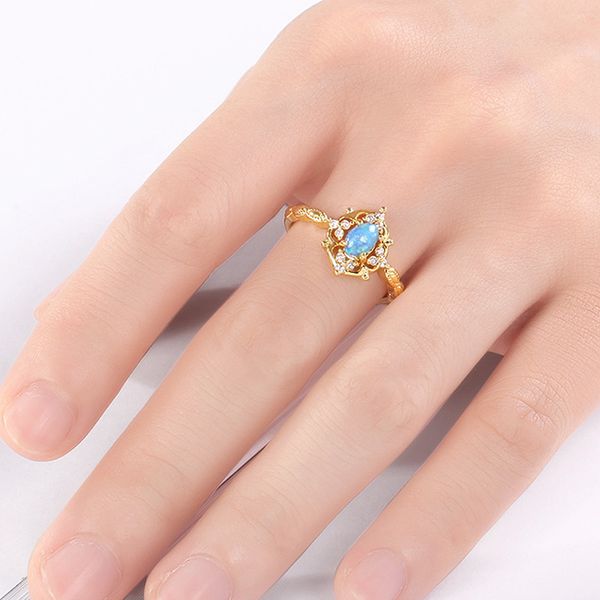 

Flowing light and color Western retro style carved and hollowed out opal small egg surface 925 pure silver goldplated retro ring