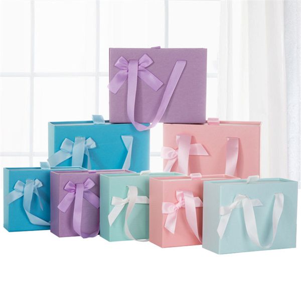 Presentes sacos de papel com alças Jóias Shopping Bag Gift Wrap reciclável Cosmetic Box Gift Bag 4 cores