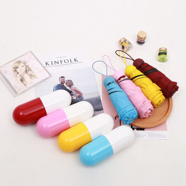

capsule umbrellas ultra - light mini sunscreen small pockets fifty - umbrella black plastic folding pocket type custom logo r5332