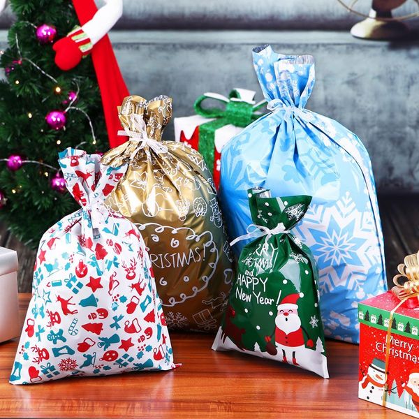 

30pcs christmas gift bags cute drawstring assorted styles goody bags gift wrapping party favors for christmas holiday candy bag an2958