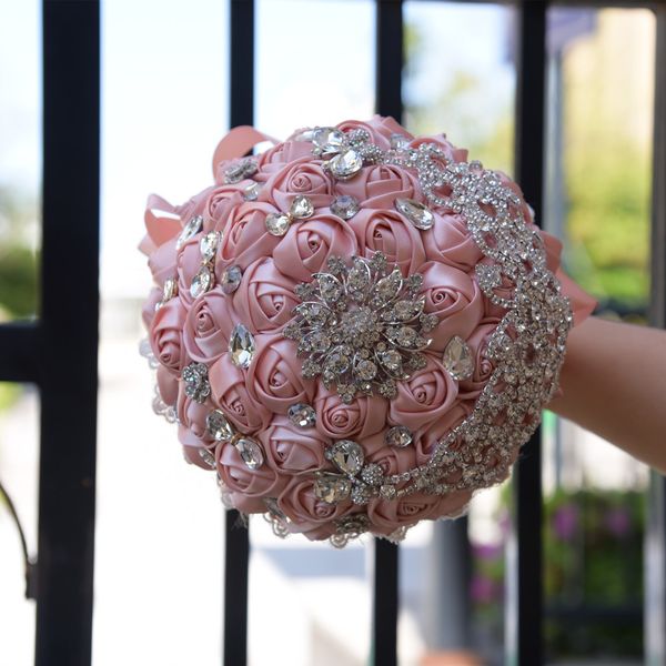 

artificial handmade rose flowers bridal bouquets crystal adorned brooch handholds wedding suppliers bride holding flowers