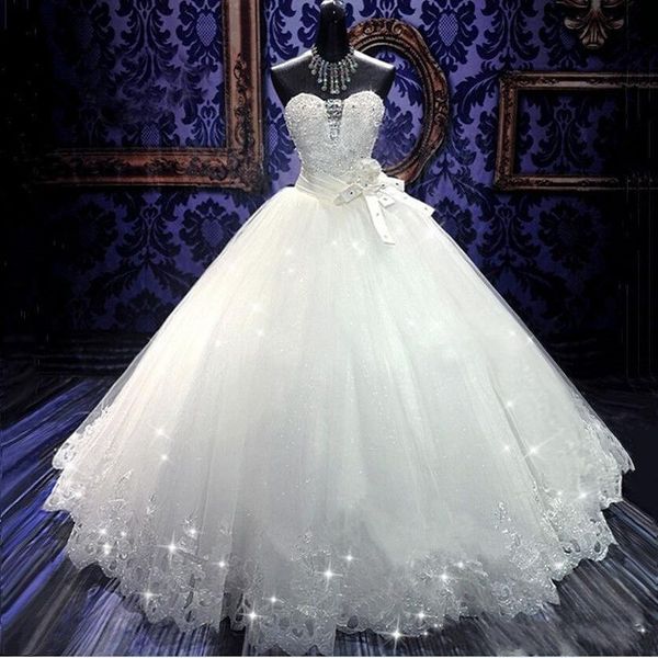 2020 Abiti da sposa economici A Line sexy Bling Sweetheart senza maniche in pizzo Applicazioni di perle di perline di cristallo Abito da ballo con fiocco Abiti da sposa formali