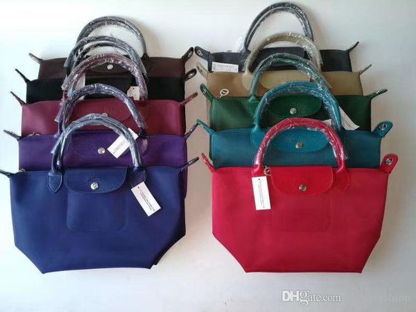 

new sell style woman bag made of waterproof material with genuine leather handle and long strap woman tote shopping folding bag