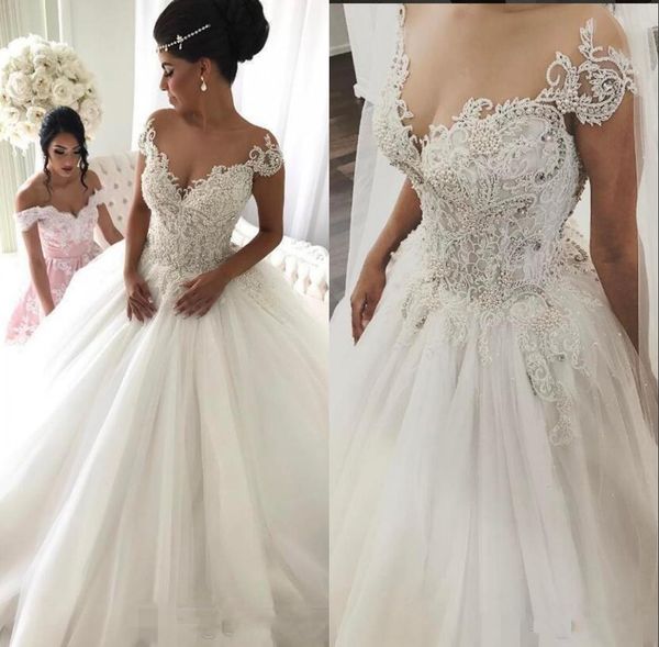 

Luxury Arabic Lace 2019 A Line Wedding Dresses Sheer Neck Beaded Cap Sleeves Tulle Plus Size Wedding Dress Vintage Sexy Bridal Gowns