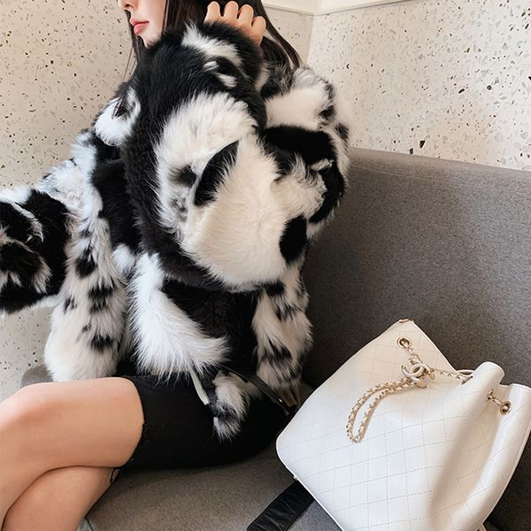 

fur coat with black-and-white tuscany outline and skinny anti-season fur coat