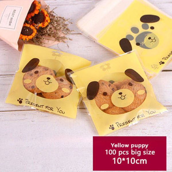 

100pcs self adhesive packaging bag yellow background cartoon transparent dog head soap biscuits birthday party gift bag