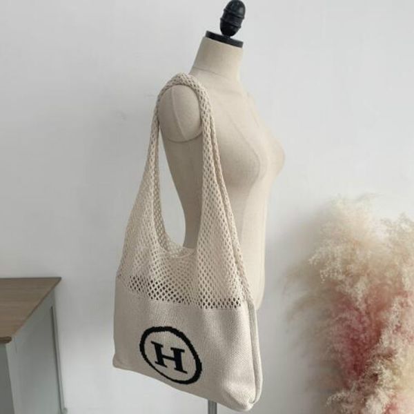 

2020 large capacity knitting handbag women letter hollowed-out woven mesh knit female one shoulder bags