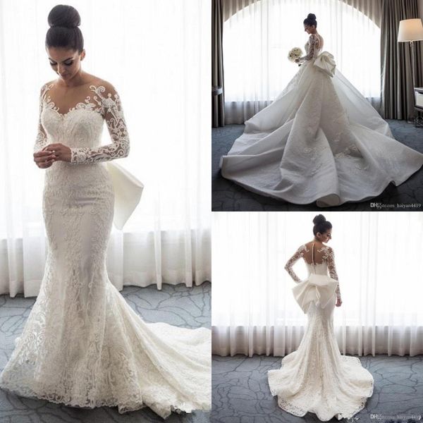 

2019 luxury mermaid wedding dresses sheer neck long sleeves illusion full lace applique bow overskirts button back chapel train bridal gowns, White