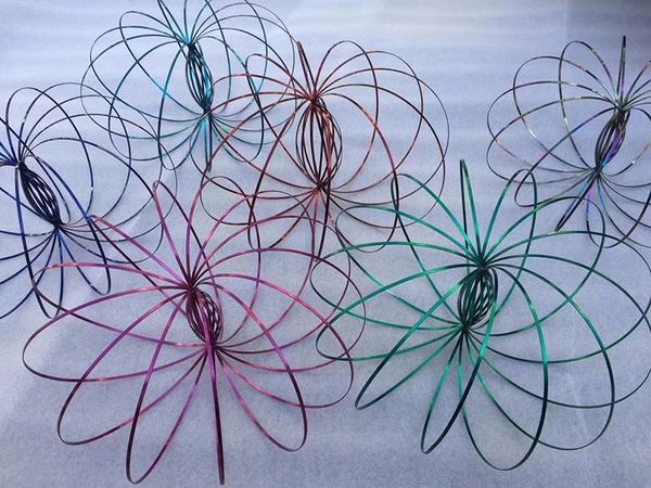 

Whole ale xmax gift metal colored toroflux flow ring toy holographic by while moving create a ring flow rainbow flow ring