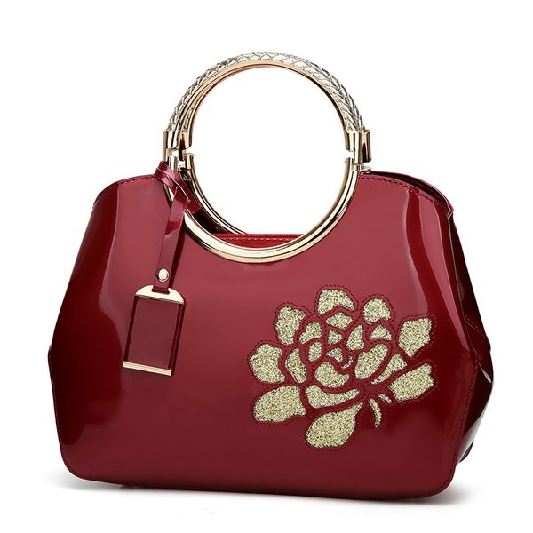 

2019 new stylish lacquered leather hand-held women's bag bright-faced shell lady bag one shoulder slanted cross