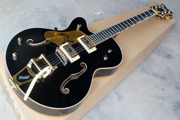 

factory custom rosewood fingerboard left-handed black body electric guitar with golden hardware,tremolo bridge,can be customized