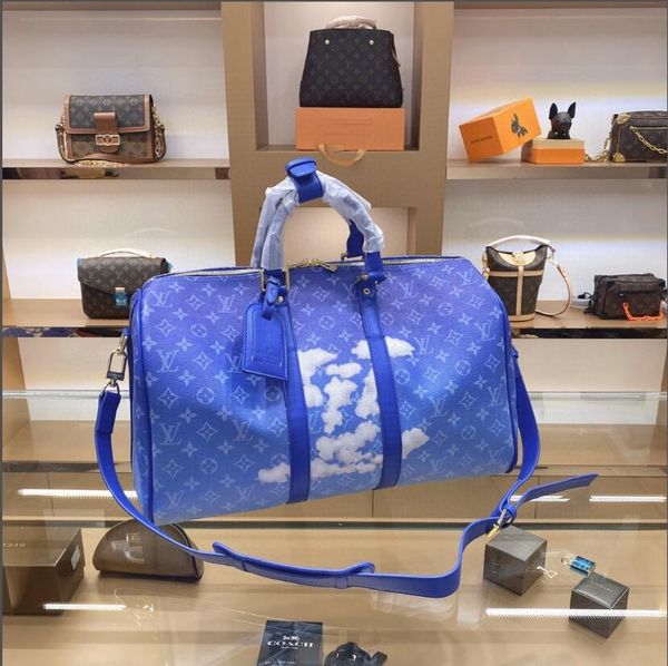 

new men and women models fashion wild large-capacity travel bag female models blue sky and white cloud models shoulder bag backpack