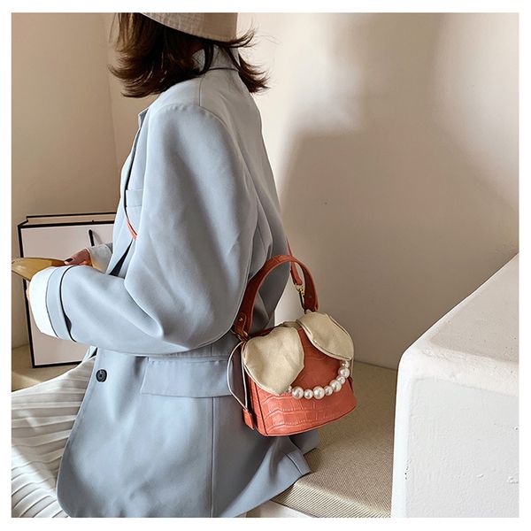 

2020 new fashion one-shoulder solid color cute design ladies bag simple wild bucket bag fashion messenger