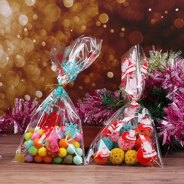 

50pcs / lot transparent plastic bag christmas candy bags baking packing bags cellophane santa claus snowman party favor