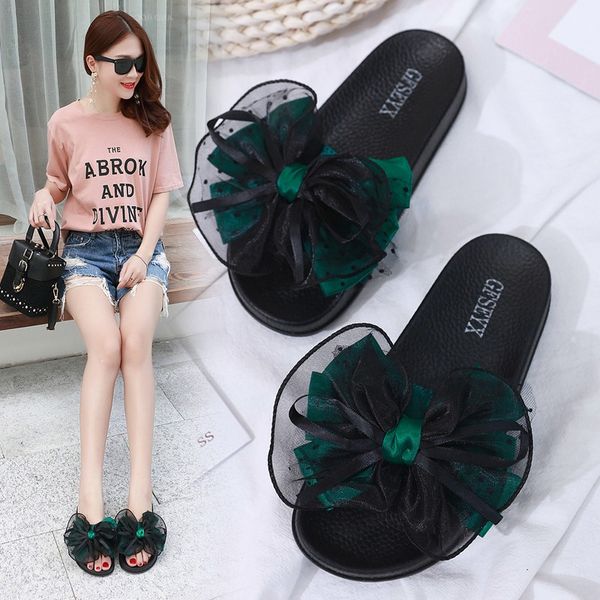 

lovely girl in spring wearing new anti-skid indoor slippers, bow tie and big net red outside summer, Black