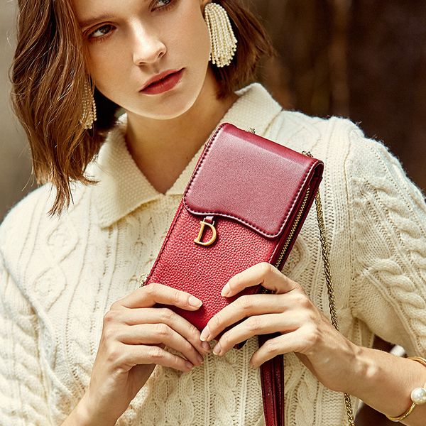 

2019 mobile phone bag female leather new single shoulder slung small baotou layer leather mini bag. hand bags